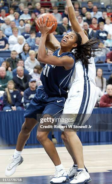 University of Connecticut basketball player Jessica Moore with the ball during a game at Gampel Pavilion, Storrs, Connecticut, April 19, 2002.