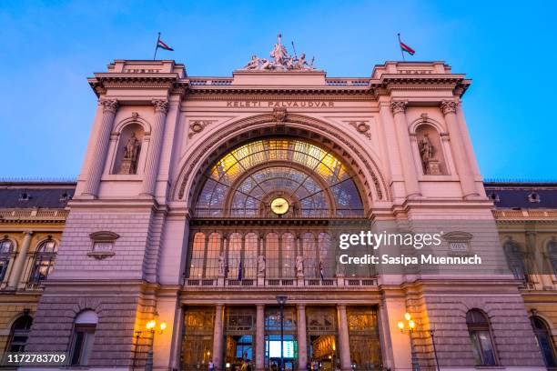 main facade of budapest keleti station at sunset - budapest train stock pictures, royalty-free photos & images