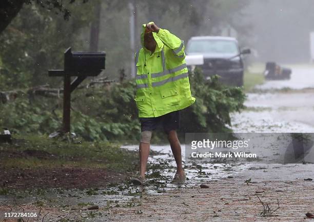Resident inspects neighborhood damage after Hurricane Dorian hit the area, on September 6, 2019 in Kitty Hawk, North Carolina. Dorian passed...