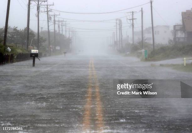Water floods Highway 12 as Hurricane Dorian hits the area on September 6, 2019 in Nags Head, North Carolina. Dorian passed Charleston S.C. Yesterday...
