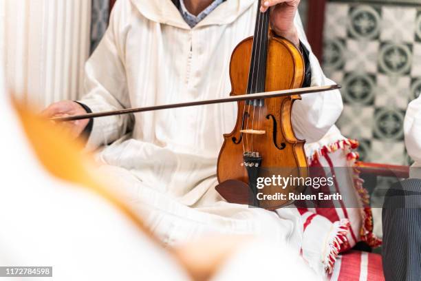 moroccan musician playing violin - moroccan culture stock pictures, royalty-free photos & images