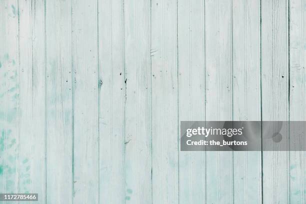 full frame shot of light turquoise painted wooden wall - holzwand shabby chic stock-fotos und bilder