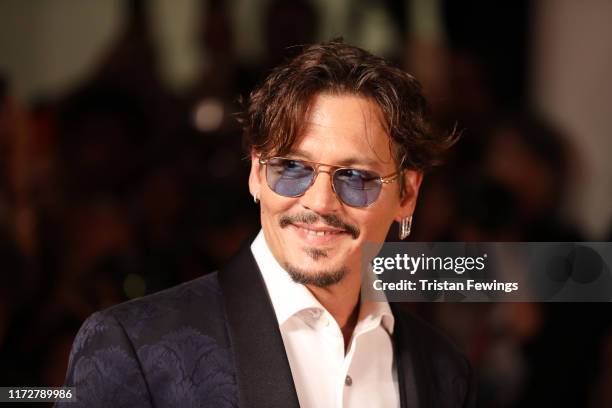 Johnny Depp walks the red carpet ahead of the "Waiting For The Barbarians" screening during the 76th Venice Film Festival at Sala Grande on September...