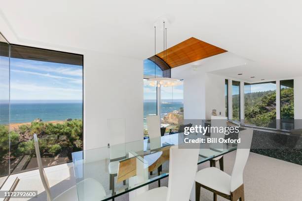 modern dining area in california, oceanfront home. stock photo - waterfront dining stock pictures, royalty-free photos & images