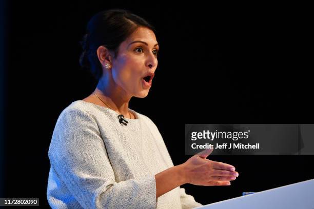 Home Secretary, Priti Patel addresses the delegates on the third day of the Conservative Party Conference at Manchester Central on October 1, 2019 in...
