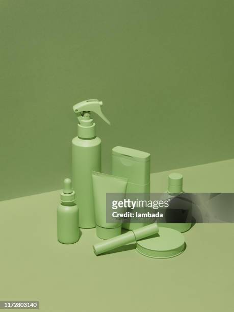 cosmetic products in monochrome green color - sustainable cosmetics stock pictures, royalty-free photos & images