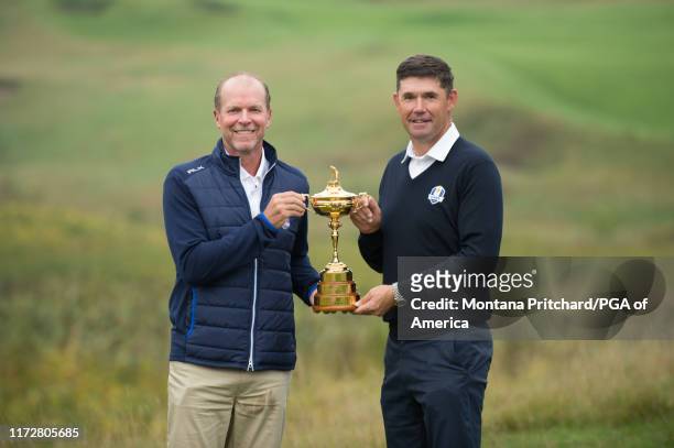 United States Team Captain, Steve Stricker and Europe Team Captain, Padraig Harrington pose for a photo with the ryder cup trophy during the Ryder...