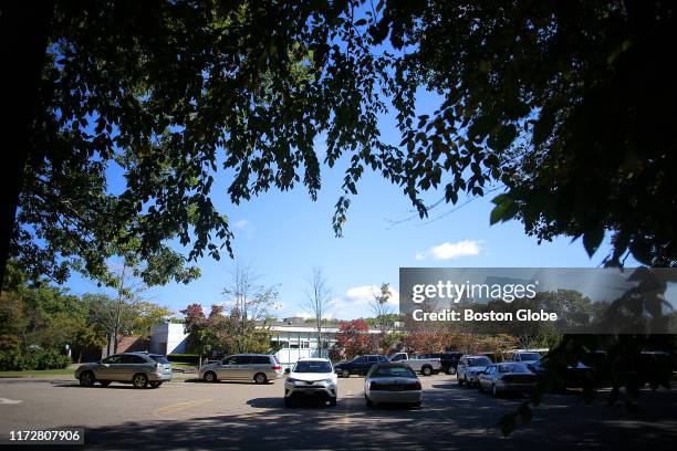 The parking lot next to the former Mishkan synagogue property, ringed by woods, is pictured in Newton, MA on Sep. 25, 2019. Boston College bought the...