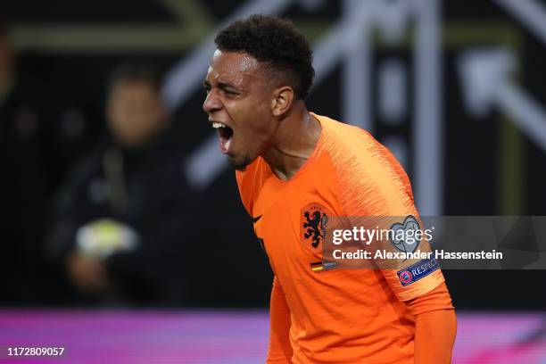 Donyell Malen celebrates after scoring his team's third goal during the UEFA Euro 2020 qualifier match between Germany and Netherlands at...