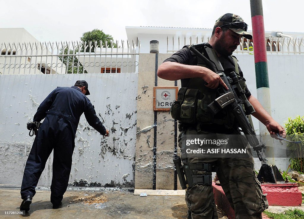 A Pakistani police commando stands guard
