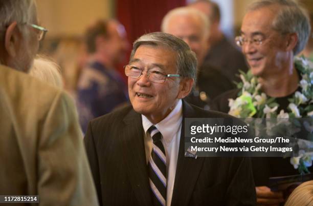 Norman Mineta, former U.S. Secretary of Transportation, talks with fellow attendees during the memorial service for the late John Vasconcellos at...