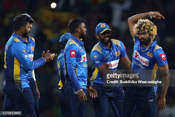 Lasith Malinga of Sri Lanka celebrates with team mates he after takes wicket of Ross Taylor during the Twenty20 International match between Sri Lanka...