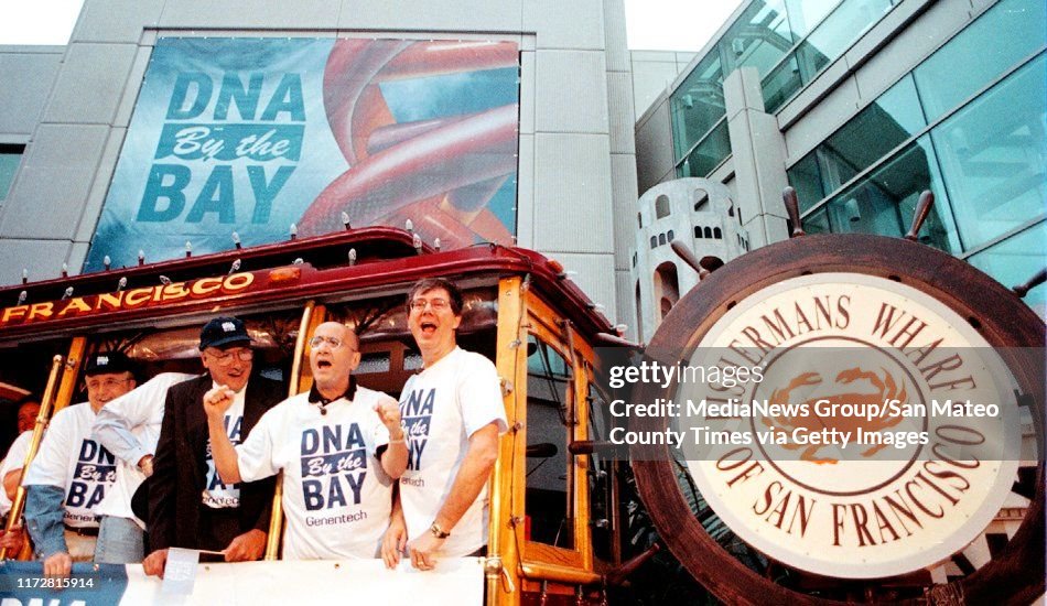 San Francisco, CA July 20, 1999: Genentech Ceo Arthur Levinson, right, NYSE Chairman and CEO Richard A. Grasso, hands raised, South San Fracisco Mayor, Jim Datzman and others kick off the day of trading at the NYSE from a cable car at Genentech headquarte