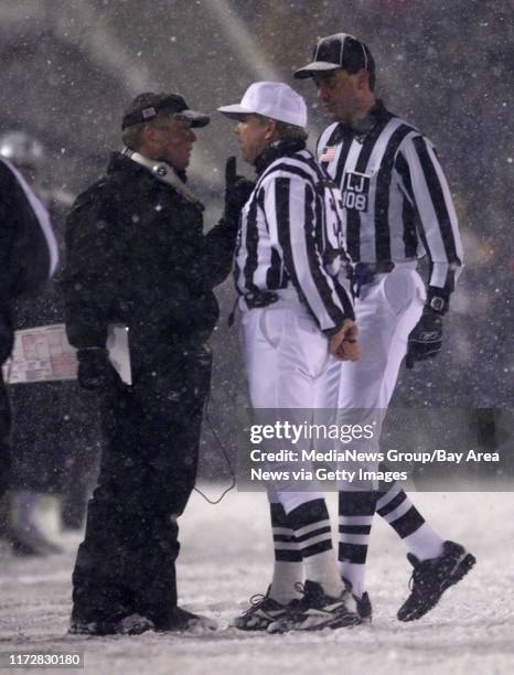 Oakland Raiders head coach Jon Gruden, left, argues with the refs concerning an overturned fumble, which would have given the Raiders the win, during...