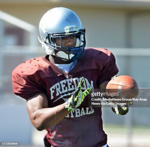 Freedom High School's football player Joe Mixon, catches a pass during practice in Oakley, Calif., on Thursday, Aug. 22, 2013.
