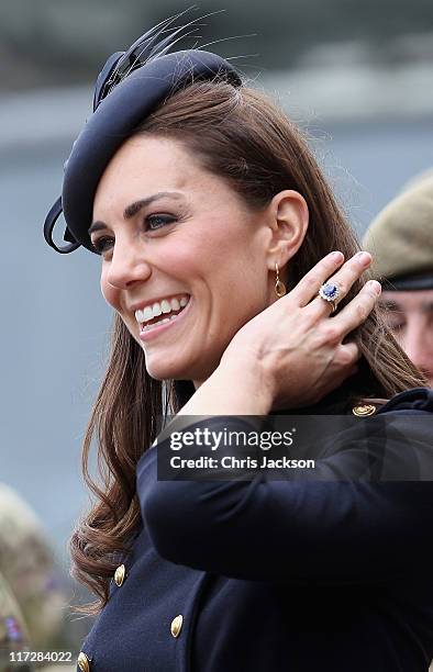 Catherine, Duchess of Cambridge presents medals to members of the Irish Guards at the Victoria Barracks on June 25, 2011 in Windsor, England. The...