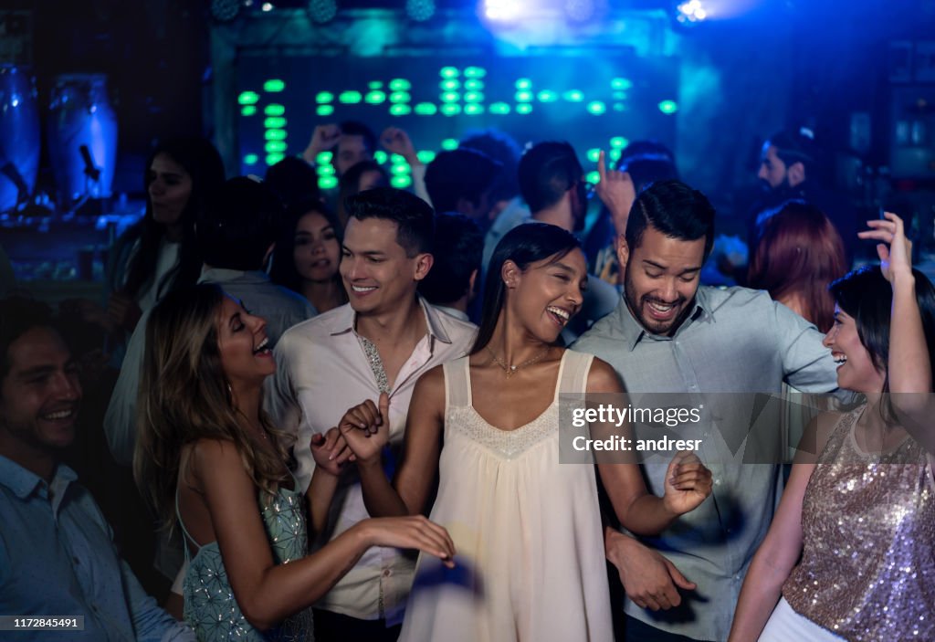 Dancing In Party Happy People Dancing At The Nightclub And Enjoying The Party High-Res ...