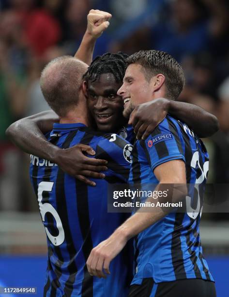 Duvan Zapata of Atalanta BC celebrates with his team-mate Andrea Masiello and Hans Hateboer after scoring the opening goal during the UEFA Champions...