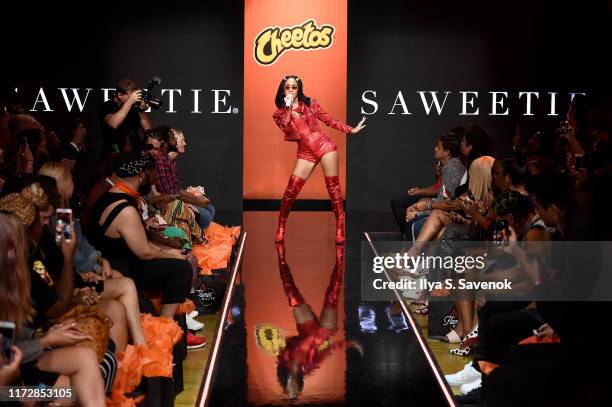 Saweetie performs onstage as Cheetos unveiled fan-inspired versions of the #CheetosFlaminHaute look at The House Of Flamin' Haute Runway Show + Style...