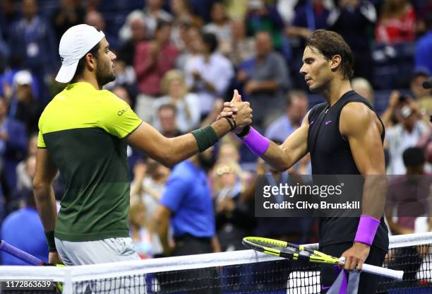 Rafael Nadal of Spain shakes hands at the net after his straight sets victory in his Men's Singles semi-final match against Matteo Berrettini of...