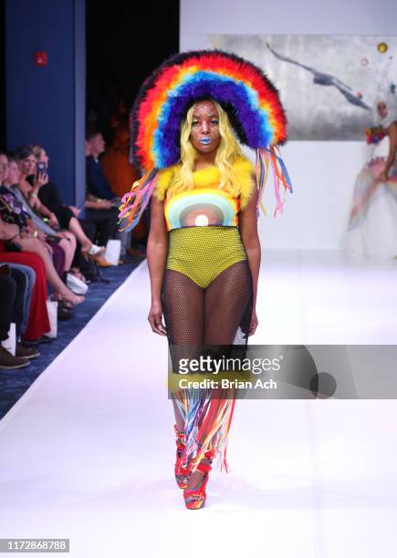 Model walks the runway wearing Dominion Couture Costume by Tara Bryant Johnson during NYFW Powered By hiTechMODA on September 06, 2019 in New York...