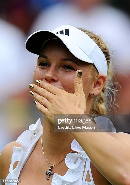 Caroline Wozniacki of Denmark blows a kiss to the crowd after winning her third round match against Jarmila Gajdosova of Australia on Day Six of the...