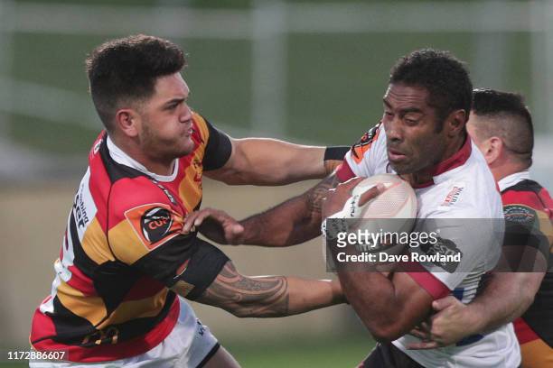Quinn Tupaea of Waikato tackles Asaeli Tikoirotuma of North Harbour during the Round 5 Mitre 10 Cup match between North Harbour and Waikato at QBE...