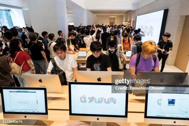 Customers try iMac desktop computers in the Apple Marunouchi store on September 07, 2019 in Tokyo, Japan. Apple inc. Opened its largest store in...