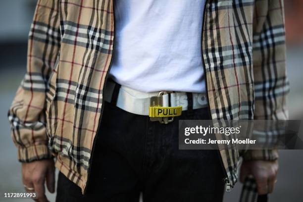 Erik Scholz wearing a Burberry jacket and bag, Nike Air Force Sneaker, Heron Preston belt and Acne Studios shirt on September 04, 2019 in Berlin,...