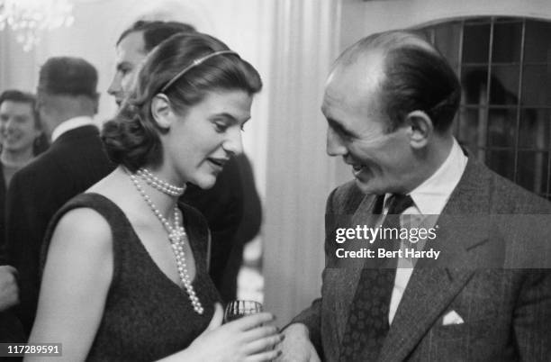 Former boxer Teddy Bushell and Lyndall Birch of ITV at a party at Gennaro's restaurant in Soho, London, given by British gangster Billy Hill to...