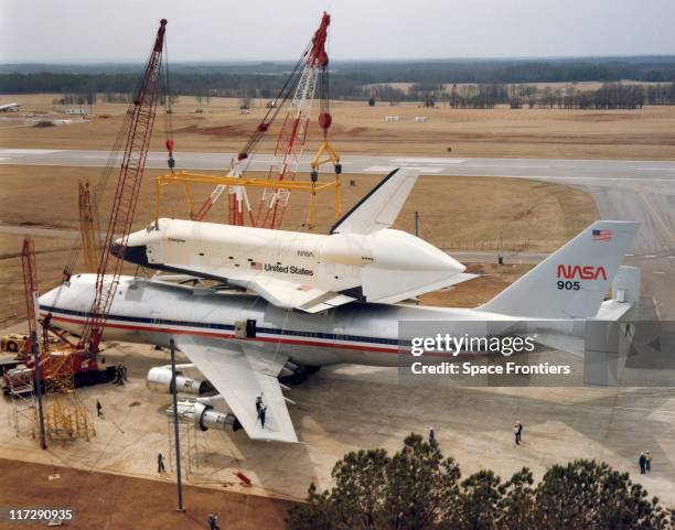 The space shuttle 'Enterprise' is offloaded from a Boeing 747 at Redstone Arsenal Airfield near Huntsville, Alabama, for Mated Vertical Ground...