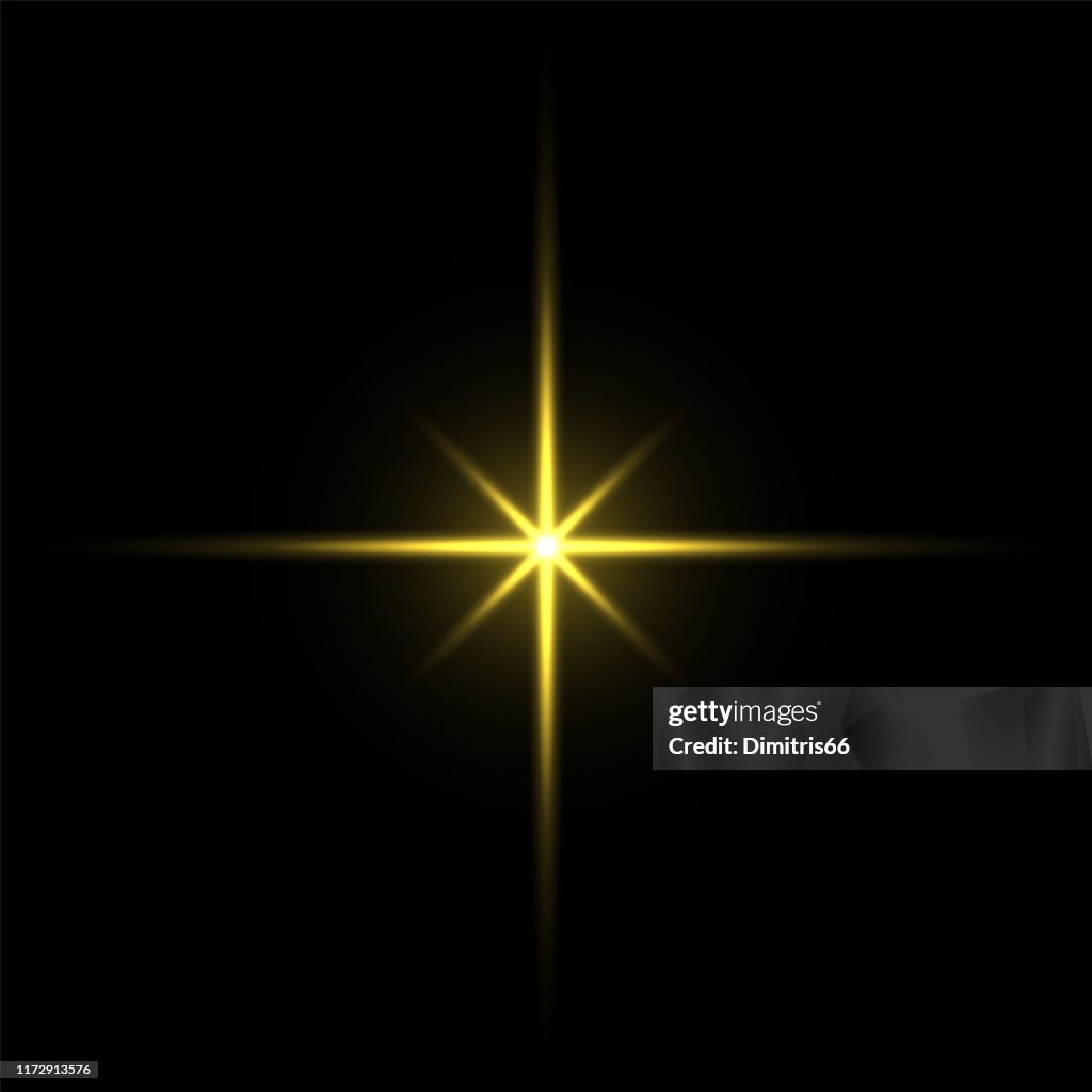 Gold light star on black background