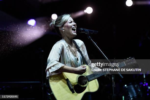 British singer Dido performs on stage during an event marking the start of "Octobre Rose" or Breast Cancer Awareness Month, on October 1, 2019 in...