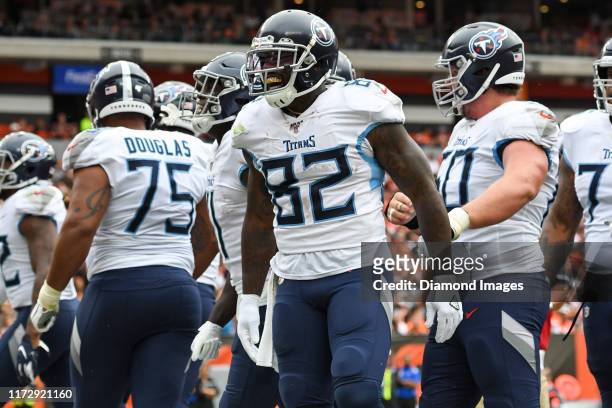 Tight end Delanie Walker of the Tennessee Titans celebrates with teammates after scoring a receiving touchdown in the fourth quarter of a game...