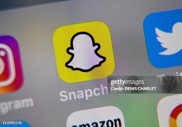 Picture taken on October 1, 2019 in Lille shows the logo of mobile app Snapchat displayed on a tablet.