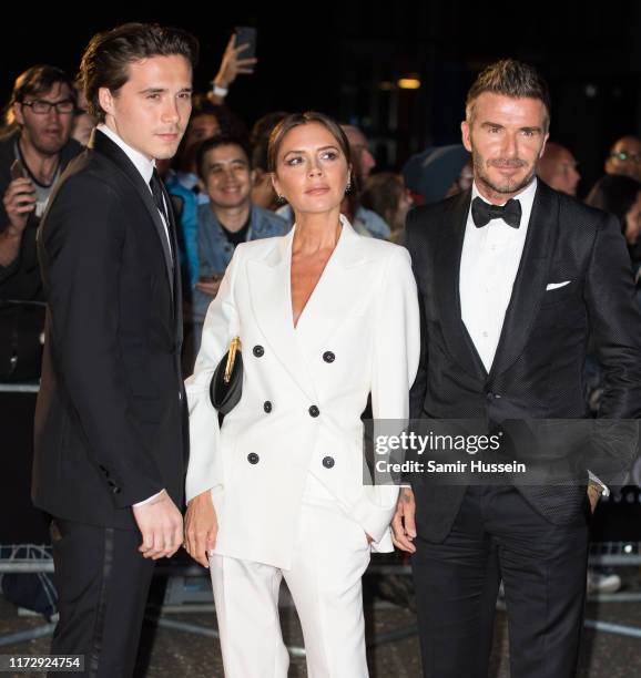 Brooklyn Beckham, Victoria Beckham and David Beckham attend the GQ Men Of The Year Awards 2019 at Tate Modern on September 03, 2019 in London,...