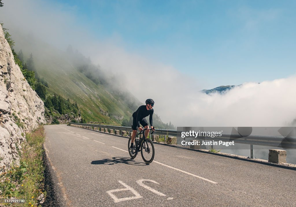 Cyclist climbing the last km of Col de la Colombière