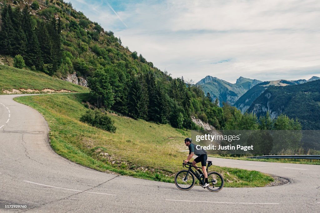 Cyclist on hairpin bend on Col de Corbier
