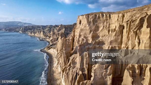 aerial panorama of sand cliffs on vlihada beach on santorini island, greece - fira santorini stock pictures, royalty-free photos & images