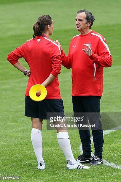 National coach Bruno Bini of France speaks to assistant coach Córine Diacre during the France Women national team training session at Rhein-Neckar...