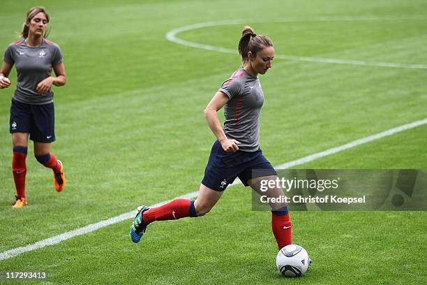 Gaetane Thiney of France runs with the ball during the France Women national team traaining session at Rhein-Neckar Arena on June 25, 2011 in...