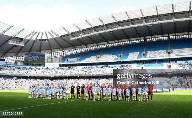 Players, officials and mascots line up on the pitch prior to the Barclays FA Women's Super League match between Manchester City and Manchester United...