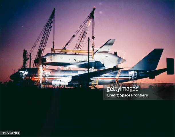 The prototype Space Shuttle Enterprise is mounted on the Boeing 747 Shuttle Carrier Aircraft before an approach and landing test at Edwards Air Force...