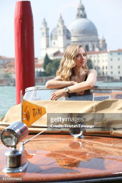 Amanda Seyfried poses on a water taxi for a portrait wearing a Jaeger-LeCoultre watch during the 76th Venice Film Festival outside of the Hotel Bauer...