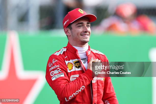 Pole position qualifier Charles Leclerc of Monaco and Ferrari celebrates in parc ferme during qualifying for the F1 Grand Prix of Italy at Autodromo...