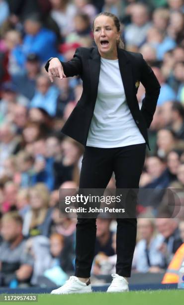 Manager Casey Stoney of Manchester United Women watches from the touchline during the Barclays FA Women's Super League match between Manchester City...