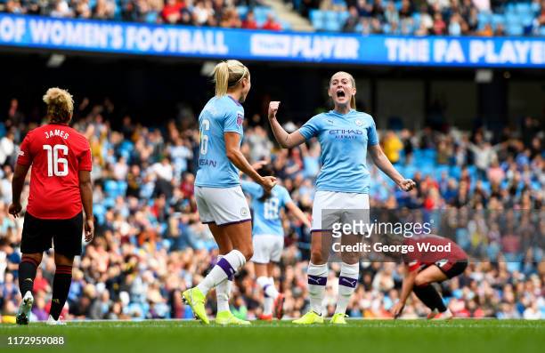 Keira Walsh and Steph Houghton of Manchester City celebrate victory after the Barclays FA Women's Super League match between Manchester City and...