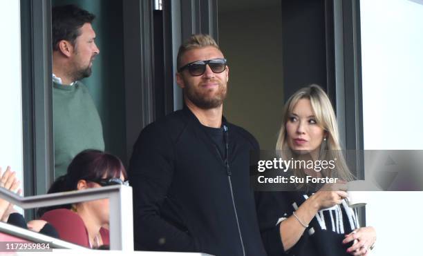 Ashes hero's Steve Harmison and Andrew 'Freddie' Flintoff watch play with Mrs Rachel Flintoff during day four of the 4th Ashes Test Match between...
