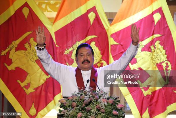 Sri Lankan opposition leader and former president Mahinda Rajapaksa speaks during an event to announce his brother, former defence secretary Gotabaya...