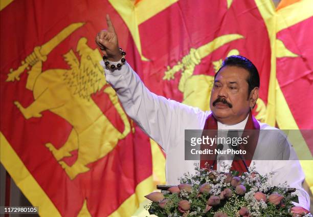 Sri Lankan opposition leader and former president Mahinda Rajapaksa speaks during an event to announce his brother, former defence secretary Gotabaya...